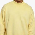 yellow sweater tied to neck tombo